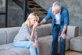 Supportive senior husband touching crying wife, asking for forgiveness Royalty Free Stock Photo