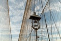 Supports of the Brooklyn Bridge. Geometry of the lines of support ropes and a vintage lantern against the sky.