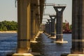 Supports of the large bridge over the river Royalty Free Stock Photo