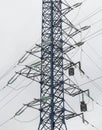 Supports of power lines. Power lines and posts. Detailed close-up. Royalty Free Stock Photo