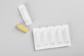 Suppositories on light background. Hemorrhoid treatment