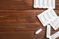 Suppositories and space for text on background, flat lay. Hemorrhoid treatment Royalty Free Stock Photo