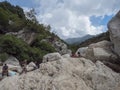 Supramonte Mountains, Nuoro, Sardinia, Italy, September 11, 2020: Group of tourist waiting for tour in Gola Su Gorropu