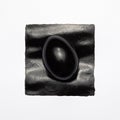 Suprematist Composition - Black Egg in a Black Square. Conceptual Easter Photo