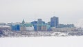 Ottawa supreme court buildings and office towers on a hill along Ottawa river