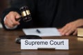 Supreme Court Nameplate With Judge Writing On Paper Royalty Free Stock Photo