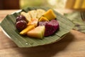 Suprise under the palm leaf breakfast made by my landlord. Airbnb has its benefits in offering this fruit fresh dish