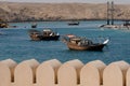 SUR, OMAN - May 27, 2014: Traditional Omani Dhows anchored in the historic harbor of Sur Royalty Free Stock Photo