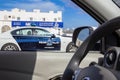 View from the side window of the car on a police car. Police car on street of the city of Sur. Sultanate