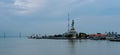 Surabaya, East Java - September 23, 2020: sailing ship on the sea and passing through under the bridge.