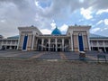 Surabaya, February 2023 : front view of Surabaya Al Akbar Mosque with a large courtyard and a dark sky as a background