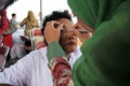 Surabaya indonesia, may 21, 201surabaya indonesia, may 21, 2014. a health worker is being check the patient`s eye health.