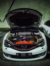 Modified white Subaru WRX STI showing the engine EJ25 boxer turbo Royalty Free Stock Photo