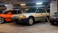 Honda Grand Civic sedan in an underground parking lot