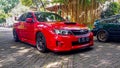 Red Subaru WRX STI sedan in car meet Royalty Free Stock Photo