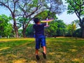 SURAKARTA INDONESIA, JULY 27 2019 : children are playing toy airplanes in the park