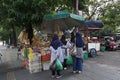 Surakarta, ID- July 16th, 2022. Several moslem woman buying Typical food from the seller on the sidewalk in front of PGS, Solo.