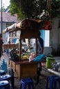 SURAKARTA, INDONESIA Ã¢â¬â JUNE 3, 2021: A street vendor is selling Nasi Kucing at the Surakarta Hadiingrat palace.