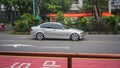 Surakarta Indonesia March 15 2022 silver BMW 318i E46 sedan driving fast on the road
