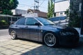 Grey Mitsubishi Lancer evolution VII GT-A CT9A on car workshop parking lot Royalty Free Stock Photo