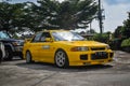 Yellow Mitsubishi Lancer evolution III leaving JDM run car meet Royalty Free Stock Photo