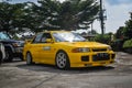 Yellow Mitsubishi Lancer evolution III leaving JDM run car meet