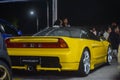 Yellow Honda NSX in night car meet