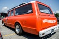Orange Chevrolet Suburban on car show Royalty Free Stock Photo