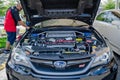 Black Subaru WRX STI showed the engine EJ25 Royalty Free Stock Photo