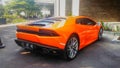 Orange Lamborghini Huracan coupe LP 610-4 on a parking lot