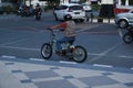 Surakarta, Indonesia - September 1, 2021: A tourist is riding a unique bicycle that looks like a motorbike in front of the Surakar