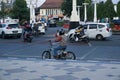 Surakarta, Indonesia - September 1, 2021: A tourist is riding a unique bicycle that looks like a motorbike in front of the Surakar