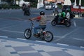 Surakarta, Indonesia - September 1, 2021: A tourist is riding a unique bicycle that looks like a motorbike in front of the Surakar