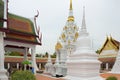 The white pagoda for remains relics of Buddha at Wat Phra Borommathat Chaiya Ratcha Worawihan in Surat Thani, Thailand.