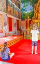 Golden buddha statue art paintings Wat Plai Laem temple Thailand