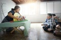 SURATTHANI,THAILAND - OCTOBER 30, 2017:Group of Asian kids sit and listen to teacher tell story with hand made Waldorf dolls