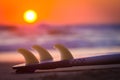 Surboard on Beach at Sunset or Sunrise Royalty Free Stock Photo