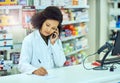 Sure, Ill have that ready for you. an attractive young female pharmacist working in a pharmacy. Royalty Free Stock Photo