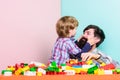 Surefire ways to bond with your son. Father son game. Dad and kid build plastic blocks. Child care development. Family Royalty Free Stock Photo