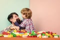 Surefire ways to bond with your son. Father son game. Dad and kid build plastic blocks. Child care development. Family Royalty Free Stock Photo