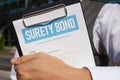 Surety bond is shown using the text on the blank Royalty Free Stock Photo