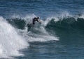 Surf board rider balances on his board.