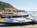 Surf-boats on beach at event waiting for next race Royalty Free Stock Photo