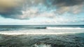 Surf break spot at the ocean in ront of the beach. vacation and sport surfing activity with many people swimming to the waves.