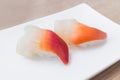 Surf or hokkigai sushi on white plate