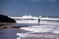 Surf fishing on Atlantic ocean coastline Adraga Beach