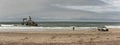 Surf fishing on the Skeleton Coast in front of the Zeila shipwreck, Namibia