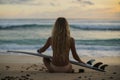 Surf girl meets sunset on the beach. blonde hair Royalty Free Stock Photo