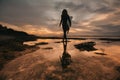 Surf girl meets sunset on the beach. silhouette