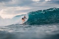 Surf girl on surfboard. Surfer woman and blue wave